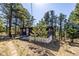 Exterior of the home with wooded surrounding at 7105 Flagstaff Rd, Boulder, CO 80302