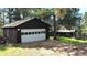 View of detached garage, including white door and space for vehicles and/or storage at 7105 Flagstaff Rd, Boulder, CO 80302