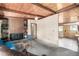 The open-concept living room with a fireplace is open to the dining and kitchen area at 7105 Flagstaff Rd, Boulder, CO 80302