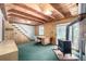 Inviting living room with wood accents and a vintage stove, blending rustic charm with comfort at 7105 Flagstaff Rd, Boulder, CO 80302