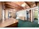 Rustic living room with wood-paneled walls and ceilings, perfect for cozy gatherings at 7105 Flagstaff Rd, Boulder, CO 80302