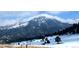 Scenic mountain view with light clouds and snow, capturing the beauty of the natural landscape at 7105 Flagstaff Rd, Boulder, CO 80302