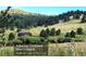 View of Myer's Gulch parkland, just one minute away by bike or car, with a building in the background at 7105 Flagstaff Rd, Boulder, CO 80302