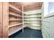 Shelved storage room with wood-paneled ceiling at 7105 Flagstaff Rd, Boulder, CO 80302