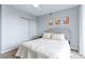 Bedroom with a queen bed, carpet, closet and soft, neutral decor for a calm, inviting space at 1441 Central St # 209, Denver, CO 80211