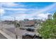An outdoor view showing a street and the city skyline, featuring a bridge and modern buildings at 1441 Central St # 209, Denver, CO 80211
