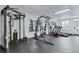 Community gym with multiple weight machines, mirror and two treadmills at 1441 Central St # 209, Denver, CO 80211
