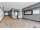 Welcoming lobby with neutral tones and decorative mirror and artwork at 1441 Central St # 209, Denver, CO 80211