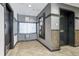 Well-maintained lobby with elevator access, mailboxes, and stone accents at 1441 Central St # 209, Denver, CO 80211