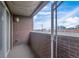 Brick patio with string lights and views of the city skyline at 1441 Central St # 209, Denver, CO 80211