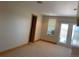 Bright room with natural light, neutral carpet, and light wood trim at 1123 S Quince Way, Denver, CO 80231