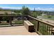 Back deck of home showing view of the landscape and mountains at 1123 S Quince Way, Denver, CO 80231