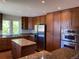 Stylish kitchen with stainless steel appliances, granite countertops, and hardwood floors at 1123 S Quince Way, Denver, CO 80231