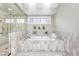 Elegant bathroom featuring a luxurious soaking tub, glass-enclosed shower, and neutral marble tiling at 465 Monroe St, Denver, CO 80206