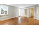Bright bedroom with large windows, wood floors, walk-in closet, and ensuite bathroom access at 465 Monroe St, Denver, CO 80206