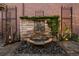 Beautiful stone fountain is surrounded by river rock and offers a calming water feature at 465 Monroe St, Denver, CO 80206