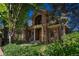 Beautiful brick home with manicured lawn and mature trees provides a cozy curb appeal at 465 Monroe St, Denver, CO 80206