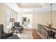 Hallway boasts hardwood floors and an open design, leading to other rooms with natural light at 465 Monroe St, Denver, CO 80206