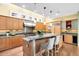 Gourmet kitchen boasts a large island, stainless steel appliances, custom cabinets, and skylights for ample lighting at 465 Monroe St, Denver, CO 80206