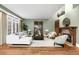Comfortable living room with decorative fireplace, hardwood floors, and many windows at 465 Monroe St, Denver, CO 80206