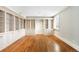 Spacious living room featuring custom built-in bookshelves and cabinets, and a large window at 465 Monroe St, Denver, CO 80206