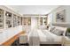 Serene bedroom with custom built-ins and bright lighting, designed for relaxation and style at 465 Monroe St, Denver, CO 80206