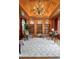 Stunning office features custom wood trim and cabinetry, complemented by a beautiful chandelier and large windows at 465 Monroe St, Denver, CO 80206