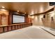 Home theater room with a large screen, sconce lighting, and decorative wood trim at 465 Monroe St, Denver, CO 80206