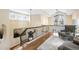 Upper hall features hardwood floors, elegant railing, and a cozy sitting area with a large window at 465 Monroe St, Denver, CO 80206
