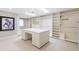 Large walk-in closet with custom shelving and a central island, perfect for organizing wardrobe at 465 Monroe St, Denver, CO 80206