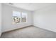 Bedroom featuring neutral carpeting and natural light from two windows at 7036 E 126Th Pl, Thornton, CO 80602