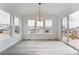 Dining area features bright light from many windows with a modern chandelier at 7036 E 126Th Pl, Thornton, CO 80602