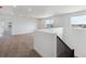 Upstairs loft with neutral carpet and two windows at 7036 E 126Th Pl, Thornton, CO 80602