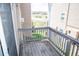Private balcony with wood railing offers outdoor space and views of the surrounding area at 1261 S Gilbert St # 202, Castle Rock, CO 80104