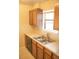Functional kitchen with stainless steel sink, laminate countertops, and ample cabinet space at 1261 S Gilbert St # 202, Castle Rock, CO 80104