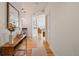 Bright hallway with hardwood floors, connecting the living spaces, offering a glimpse into the home's layout at 2195 Decatur St # 212, Denver, CO 80211