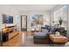 Cozy living room boasts a comfortable sectional sofa and abundant natural light, perfect for relaxation at 2195 Decatur St # 212, Denver, CO 80211