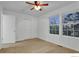 Bedroom with carpet, ceiling fan and natural light from the window at 4347 W Kenyon Ave, Denver, CO 80236