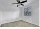 Bright bedroom features a ceiling fan and window letting in natural light at 4347 W Kenyon Ave, Denver, CO 80236