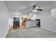 Open-concept living space with a dining area and kitchen, perfect for modern living and entertaining at 4347 W Kenyon Ave, Denver, CO 80236