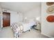 Bedroom with warm color scheme, hats on the wall, and a mirrored nightstand at 1020 15Th St # 35N, Denver, CO 80202