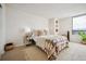 Bright bedroom featuring neutral tones, stylish decor, and a large window at 1020 15Th St # 35N, Denver, CO 80202