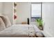Stylish bedroom with comfortable bed, modern decor, and city view at 1020 15Th St # 35N, Denver, CO 80202