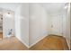 Hallway with light-colored wood floor and white walls at 1020 15Th St # 35N, Denver, CO 80202