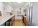 Bright kitchen with stainless steel appliances, white cabinets and modern countertops at 1020 15Th St # 35N, Denver, CO 80202