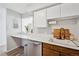 Bright kitchen with stainless steel dishwasher and modern countertop at 1020 15Th St # 35N, Denver, CO 80202