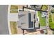 Aerial view of the home featuring solar panels, patio, lush landscaping, and a well-maintained yard at 4009 Manorbrier Cir, Castle Rock, CO 80104