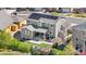 Birds eye view of the home displaying solar panels, backyard patio, and well-kept landscaping at 4009 Manorbrier Cir, Castle Rock, CO 80104