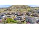 Aerial view of the home in a quiet neighborhood, featuring solar panels and a landscaped backyard at 4009 Manorbrier Cir, Castle Rock, CO 80104