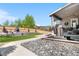 Spacious backyard featuring a fire pit, manicured lawn, and established landscaping at 4009 Manorbrier Cir, Castle Rock, CO 80104